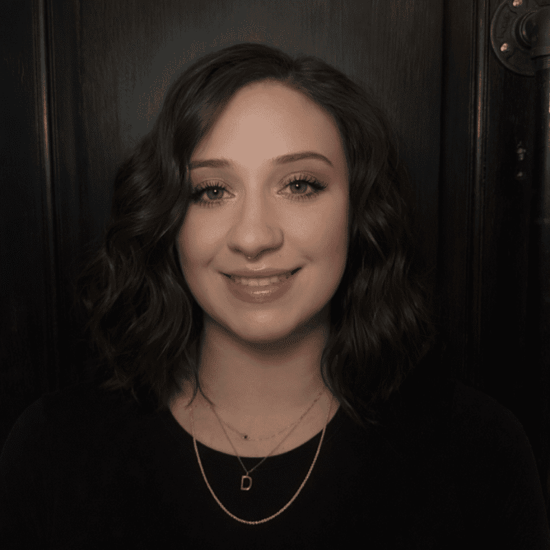 Portrait of Jael, a professional stylist at Noir et Blanc Salon, showcasing their expertise and style.